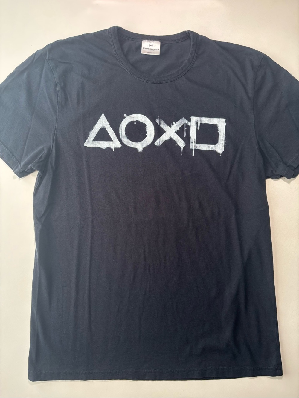 Retro Playstation buttons dripping paint graphic Sony gaming shirt